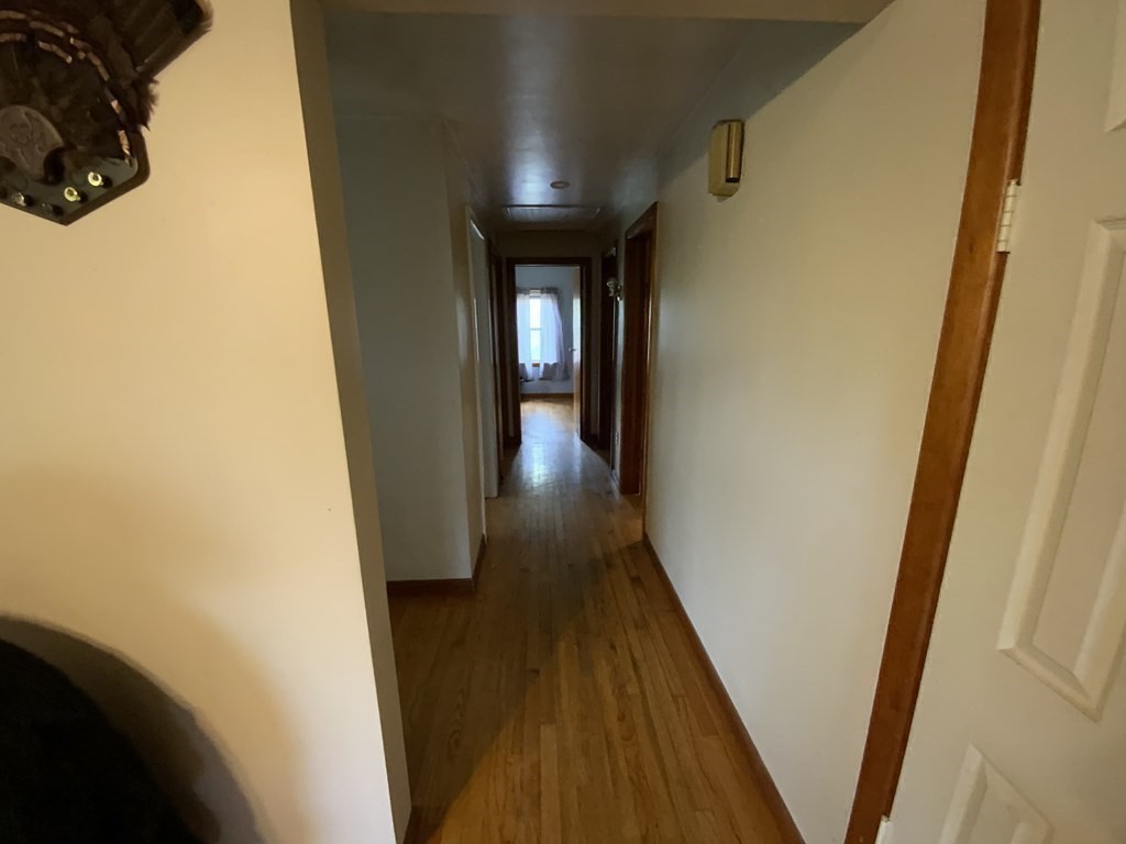 731 Greenfield Road Leyden, MA 01337 - Photo 15 of 36 a view of a hallway with wooden floor