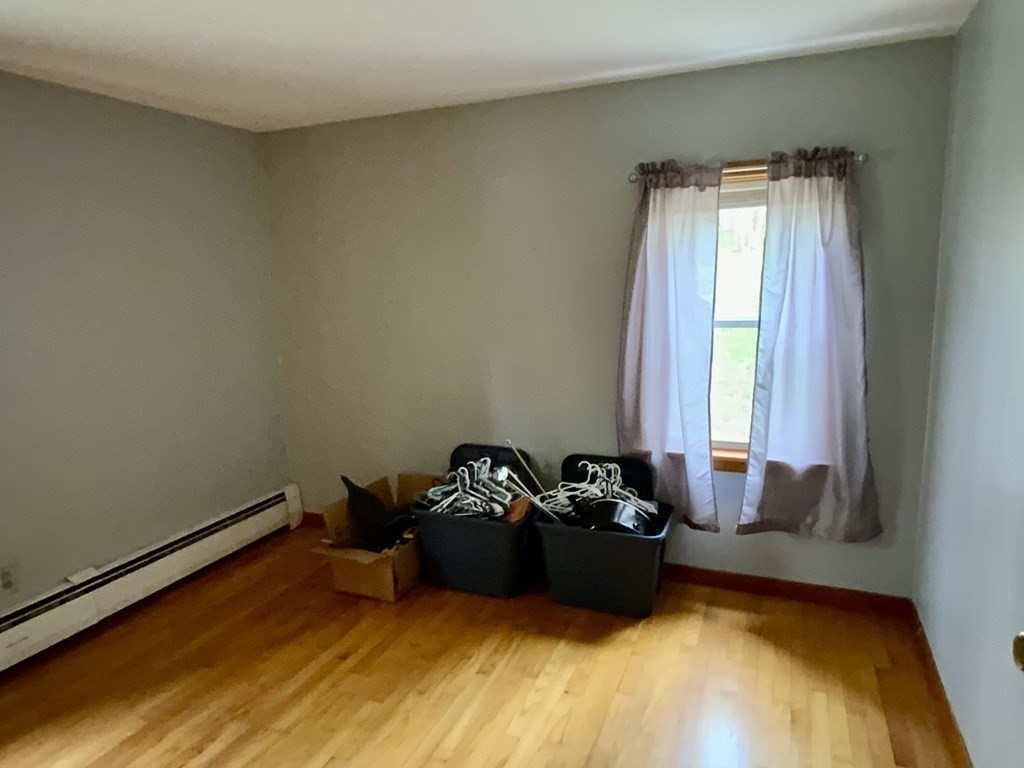 731 Greenfield Road Leyden, MA 01337 - Photo 19 of 36 a bed sitting in a bedroom next to a window