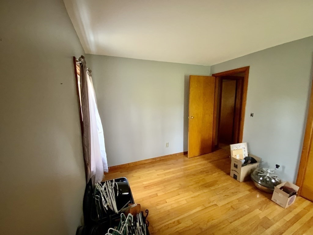 731 Greenfield Road Leyden, MA 01337 - Photo 20 of 36 a bedroom with a bed and wooden floor