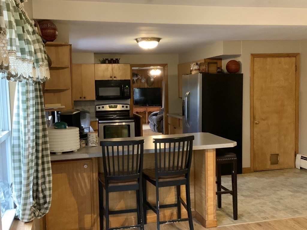 731 Greenfield Road Leyden, MA 01337 - Photo 6 of 36 a view of a dining room with furniture