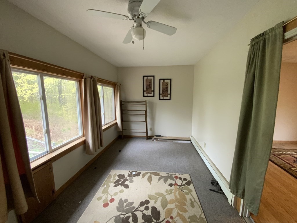 731 Greenfield Road Leyden, MA 01337 - Photo 9 of 36 a view of a hallway to a livingroom with furniture