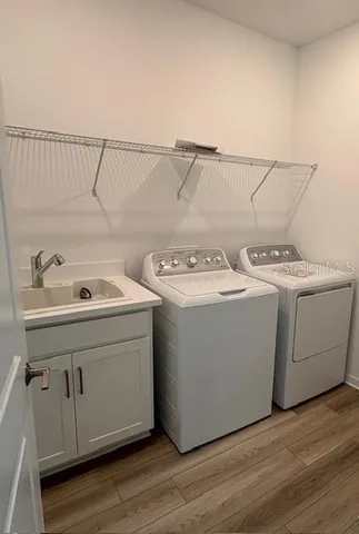 a utility room with dryer and washer