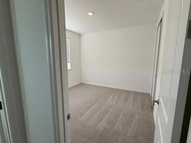 a bathroom with a double vanity sink toilet and shower