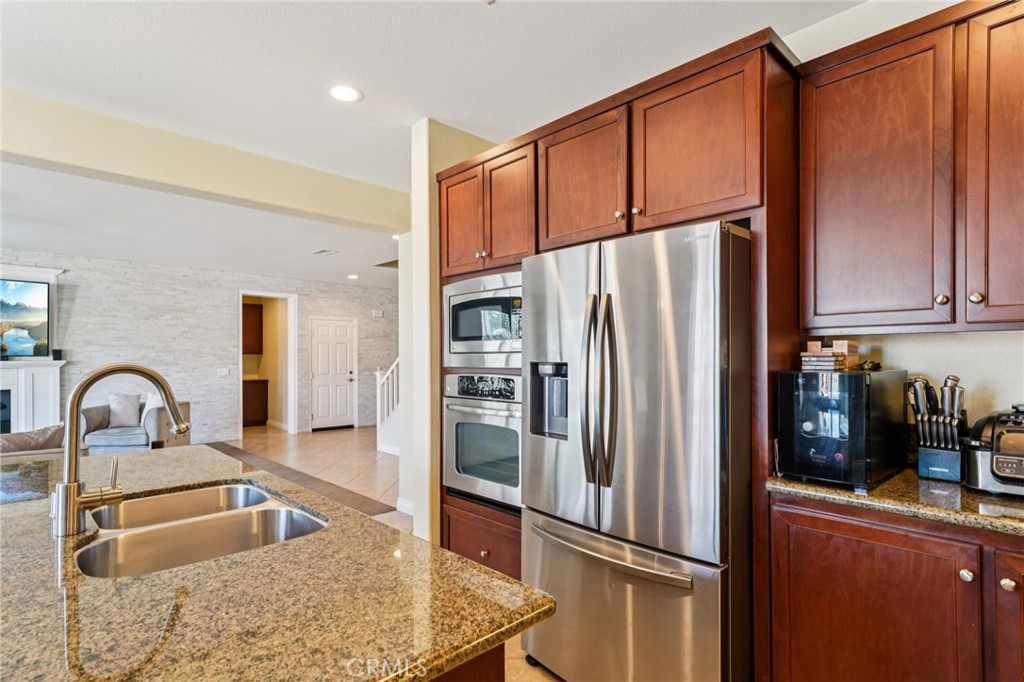 28552 Rustic Glen Street Menifee, CA 92584 - Photo 9 of 48 Functional kitchen ideal for cooking and entertaining