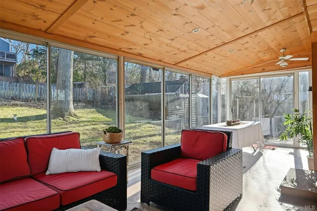 a outdoor sitting area with furniture and a garden