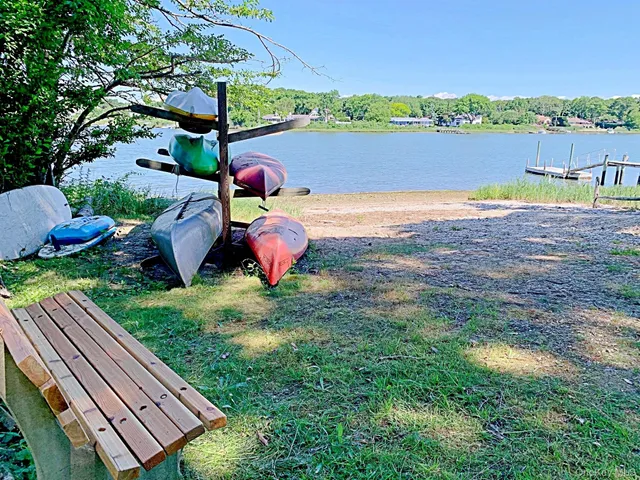 a view of a yard with a table and chair