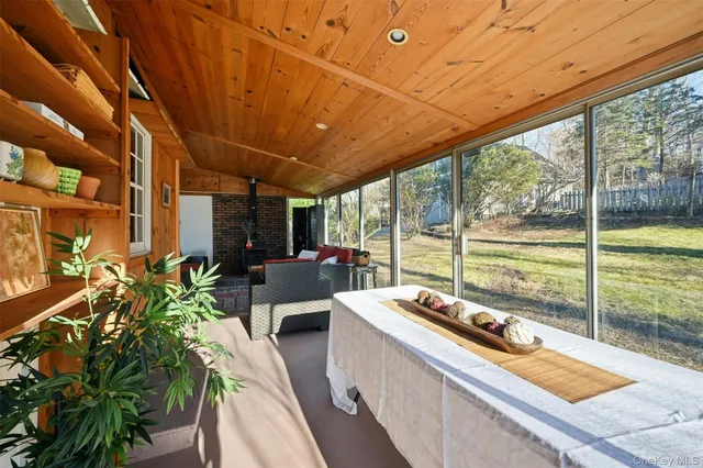 a view of a room with wooden floor and a porch