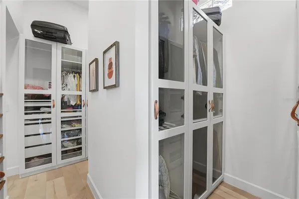 a view of walk in closet with empty racks