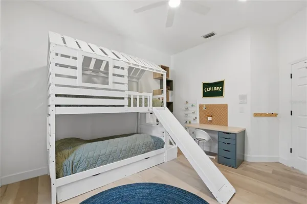 a en suite bathroom with a double vanity sink a mirror and shower