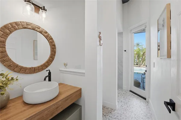 a living room with furniture a rug and a window