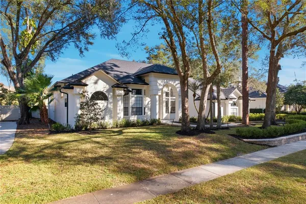 a view of a house with a yard