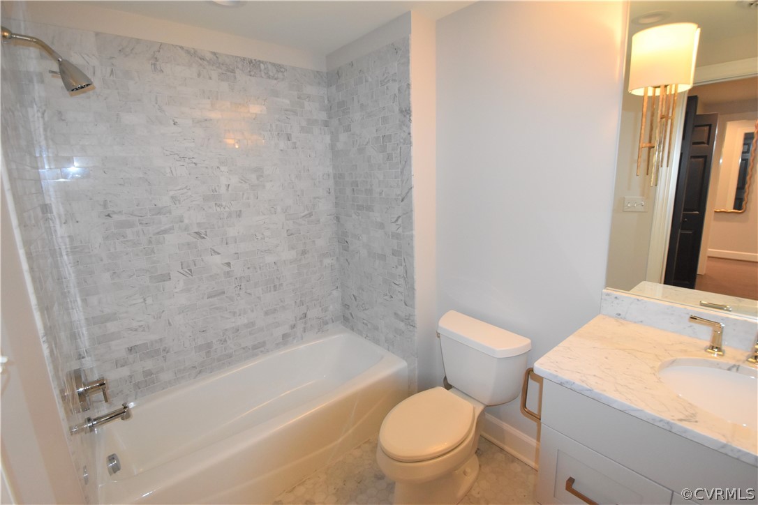 413 Stuart Circle, Unit 5B Richmond, VA 23220 - Photo 16 of 34 Hall bath with beautiful marble tile and marble va
