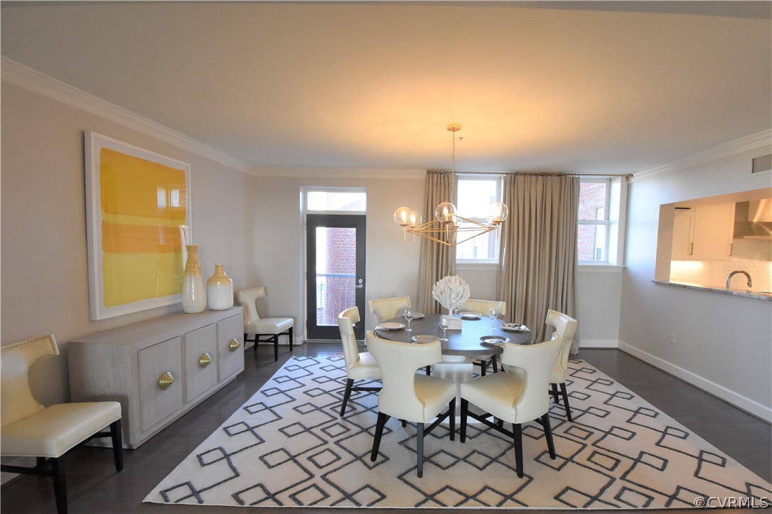 413 Stuart Circle, Unit 5B Richmond, VA 23220 - Photo 7 of 34 Dining Room with chandelier and stunning downtown