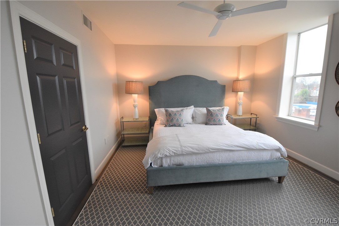 413 Stuart Circle, Unit 5B Richmond, VA 23220 - Photo 9 of 34 Master Bedroom with ceiling fan and Monument Avenu