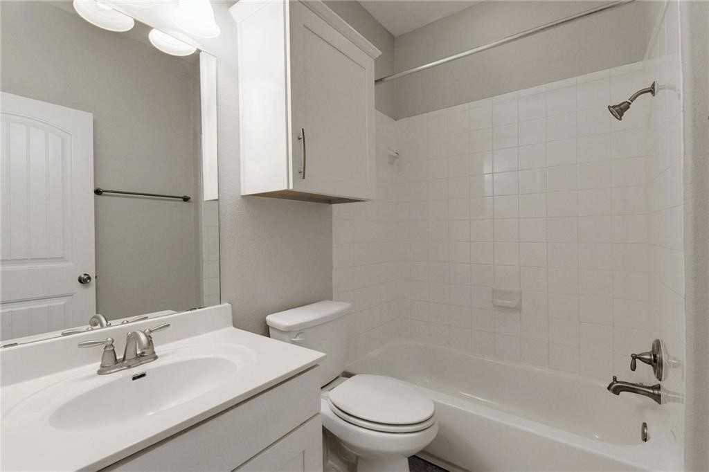 13400 Briarwick Drive, Unit 2502 Austin, TX 78729 - Photo 11 of 20 a bathroom with a sink toilet and shower