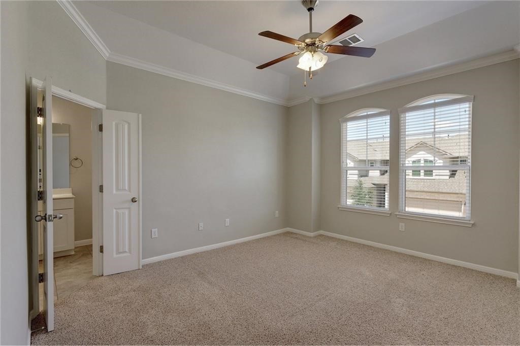 13400 Briarwick Drive, Unit 2502 Austin, TX 78729 - Photo 12 of 20 a view of an empty room with a window