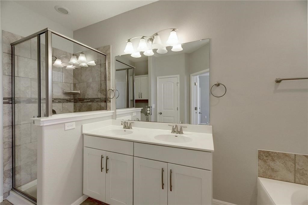 13400 Briarwick Drive, Unit 2502 Austin, TX 78729 - Photo 15 of 20 a bathroom with a sink and a mirror