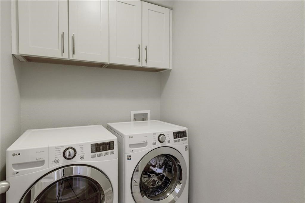 13400 Briarwick Drive, Unit 2502 Austin, TX 78729 - Photo 16 of 20 a utility room with dryer and washer