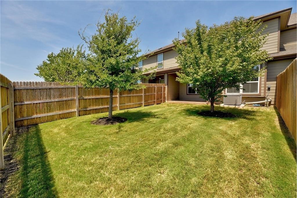 13400 Briarwick Drive, Unit 2502 Austin, TX 78729 - Photo 19 of 20 a backyard of a house with table and chairs