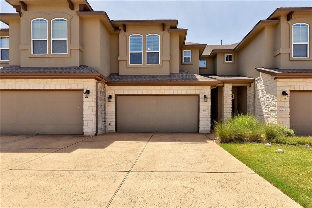13400 Briarwick Drive, Unit 2502 Austin, TX 78729 - Photo 3 of 20 a front view of a house with garden