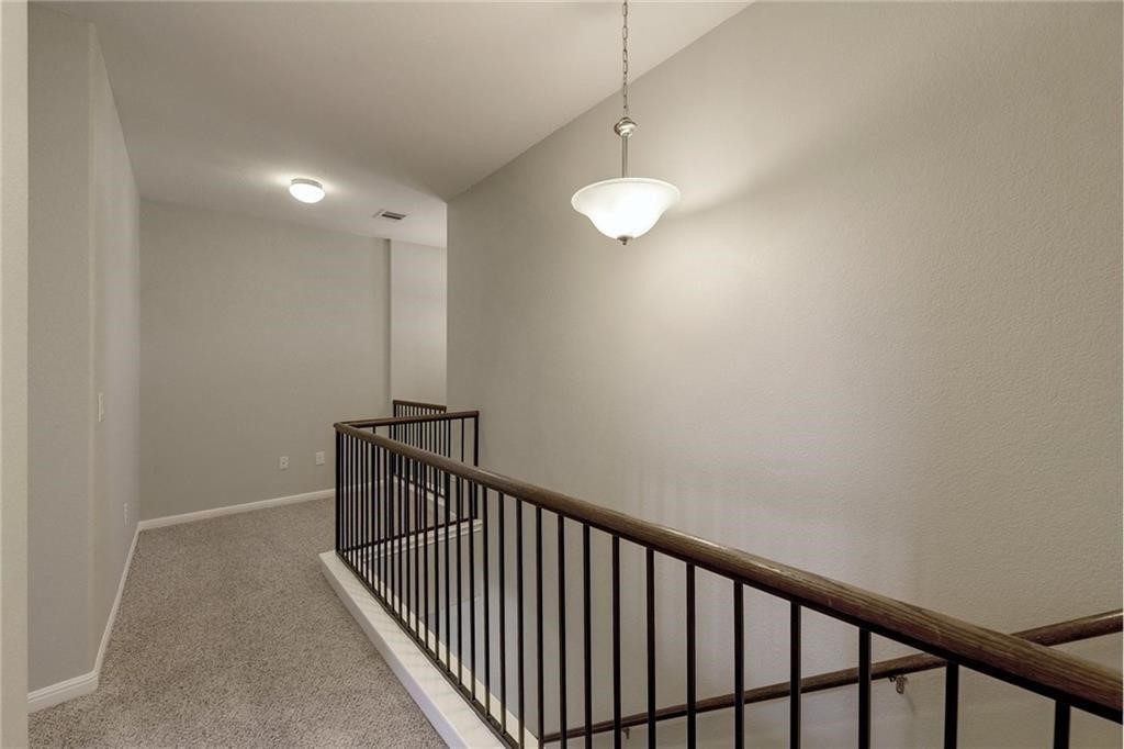 13400 Briarwick Drive, Unit 2502 Austin, TX 78729 - Photo 8 of 20 a view of hallway with stairs