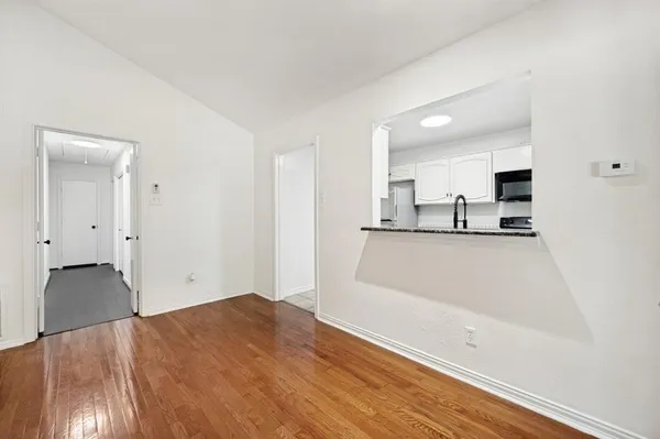 a view of a kitchen with a sink and a dishwasher cabinets