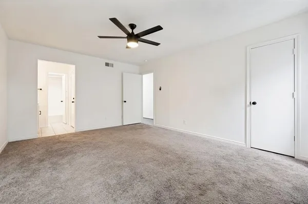 a view of a big room with carpet