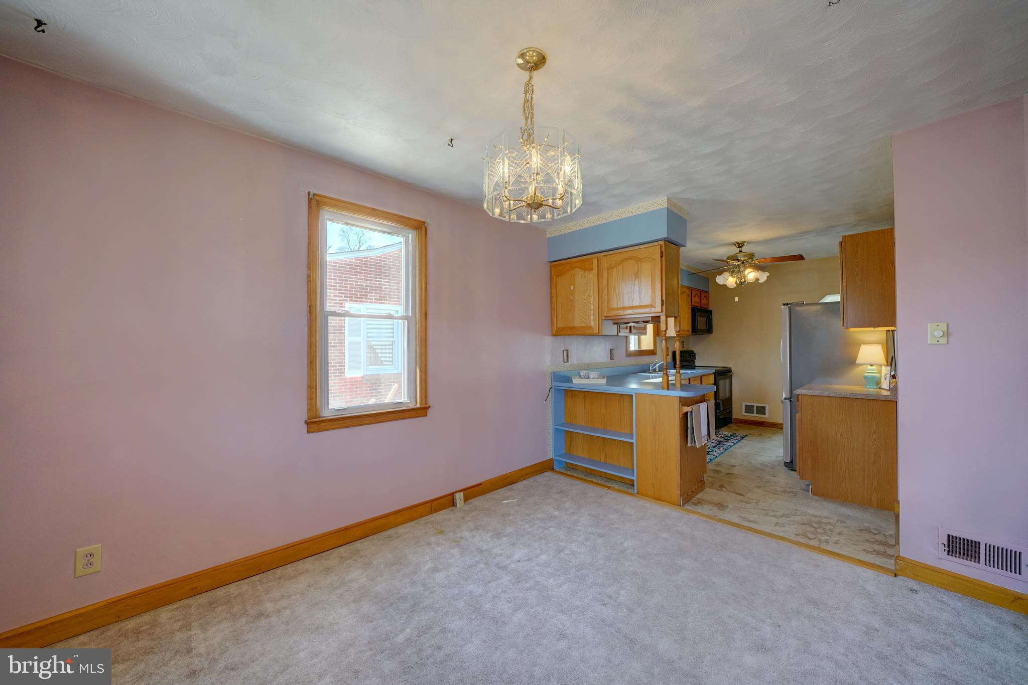 242 Carroll Road Pasadena, MD 21122 - Photo 12 of 39 Dining area flows into kitchen.