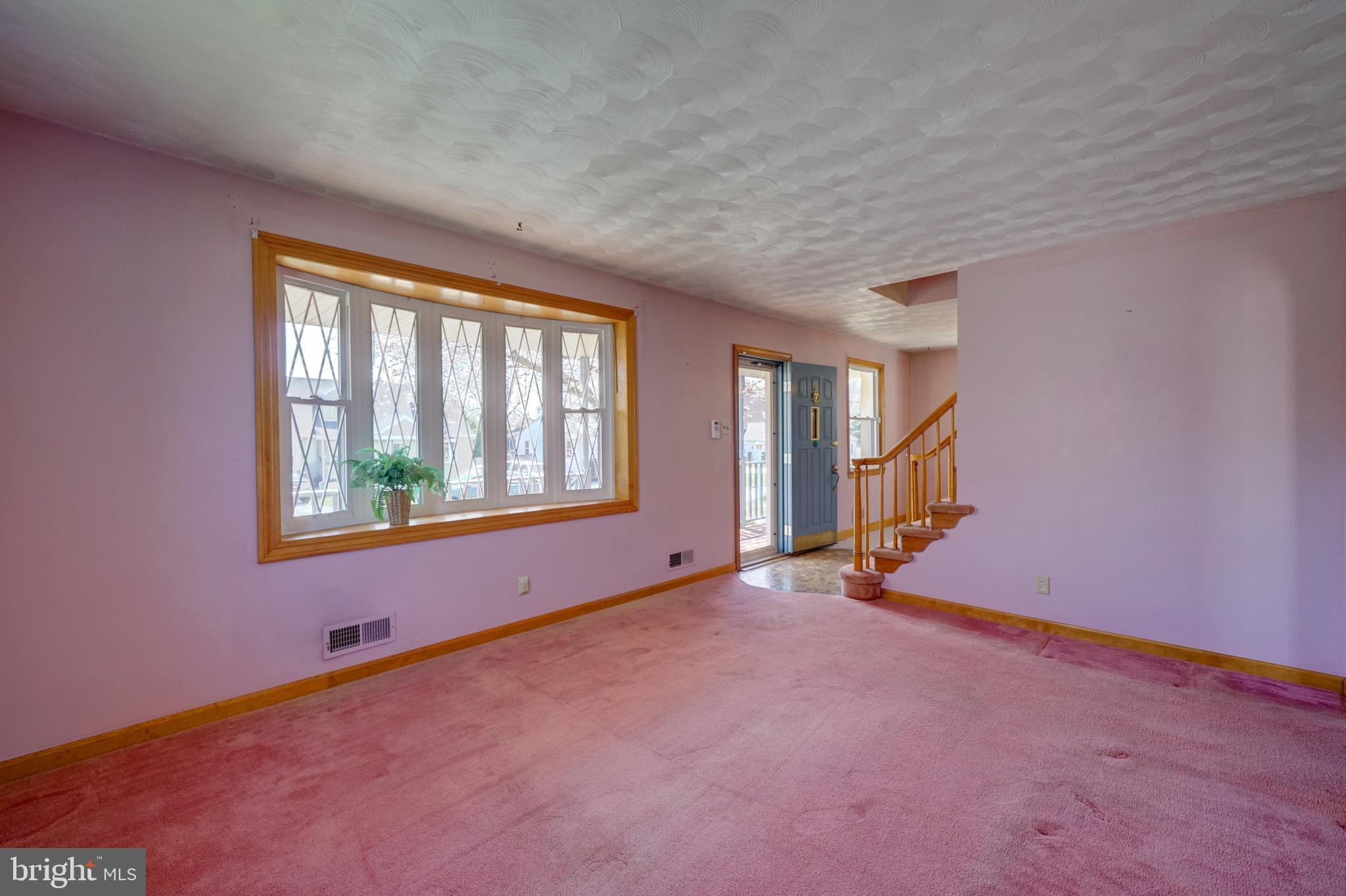 242 Carroll Road Pasadena, MD 21122 - Photo 15 of 39 Living room with bay window.