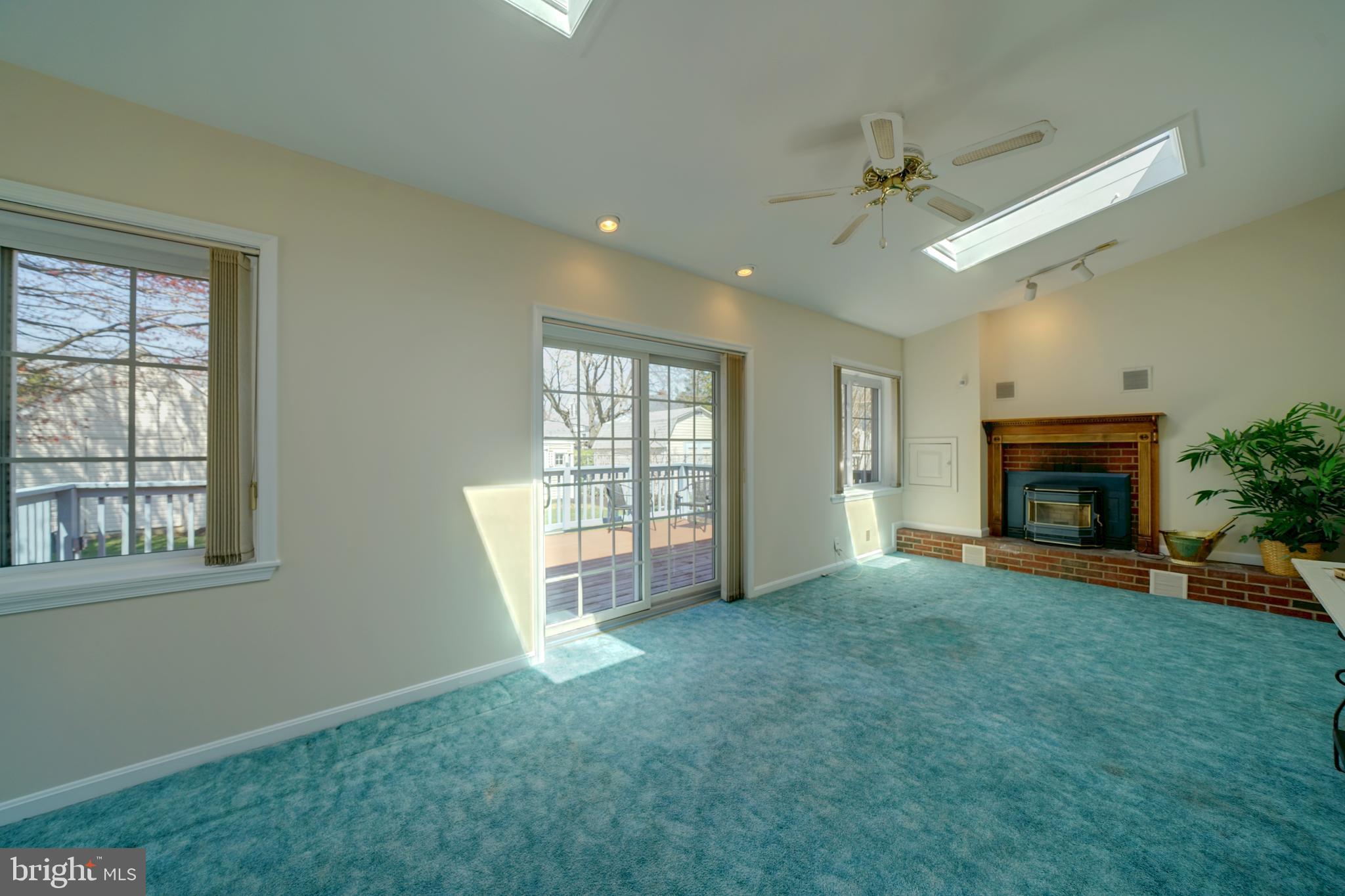 242 Carroll Road Pasadena, MD 21122 - Photo 3 of 39 Spacious family room is bright.Vault ceiling & FP.