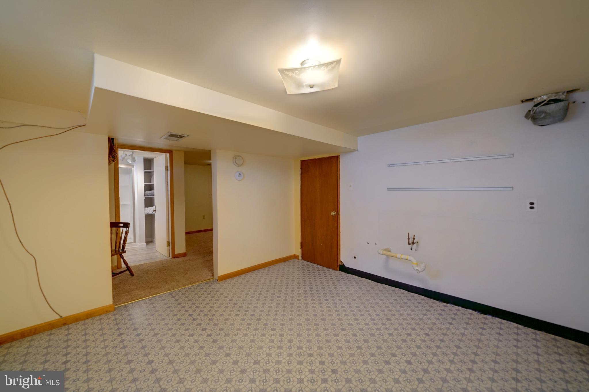 242 Carroll Road Pasadena, MD 21122 - Photo 32 of 39 Room w/rough in for kitchen/ other. In-law suite/