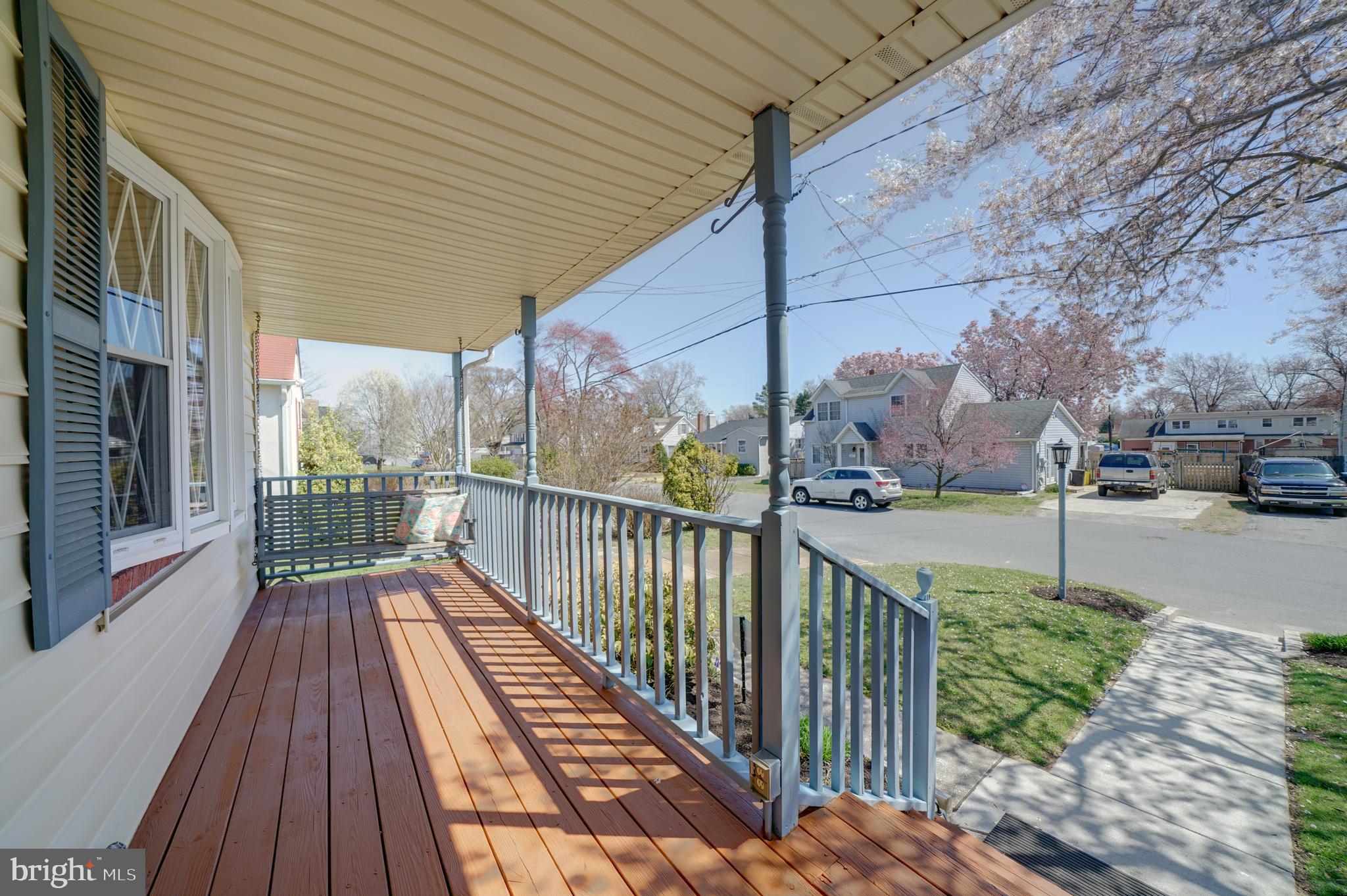 242 Carroll Road Pasadena, MD 21122 - Photo 36 of 39 Front porch swing awaits your quiet moments