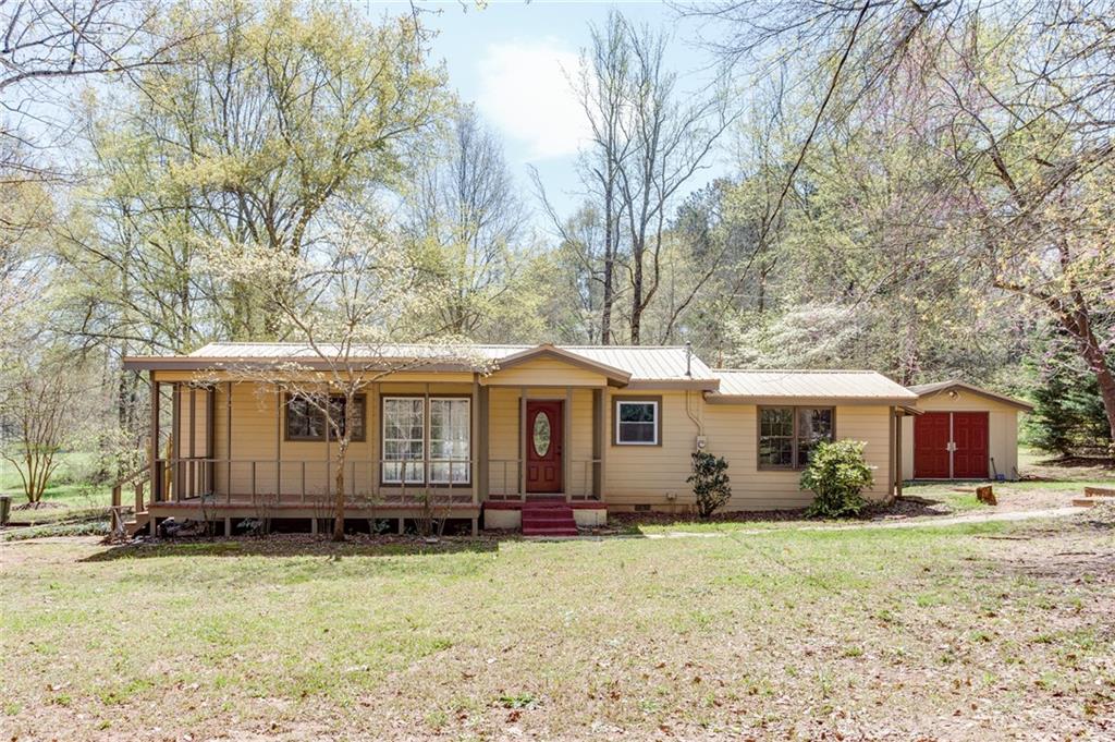 530 Geiger Road Jefferson, GA 30549 - Photo 1 of 1 a view of a house with a yard covered in snow