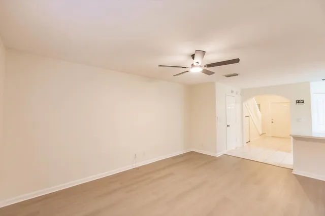 a view of a kitchen with a sink cabinets and wooden floor