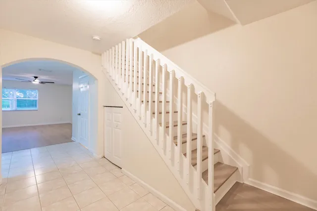 a bathroom with a double vanity sink toilet mirror and bathtub
