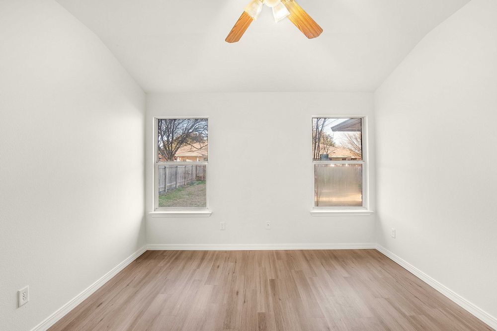 3310 Blue Ridge Drive Round Rock, TX 78681 - Photo 12 of 13 A quiet retreat with durable hardwood flooring and natural light filtering through dual windows.