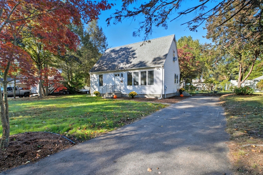 28 Collingwood Road Springfield, MA 01119 - Photo 1 of 32 a view of house in front of a big yard with plants and large trees