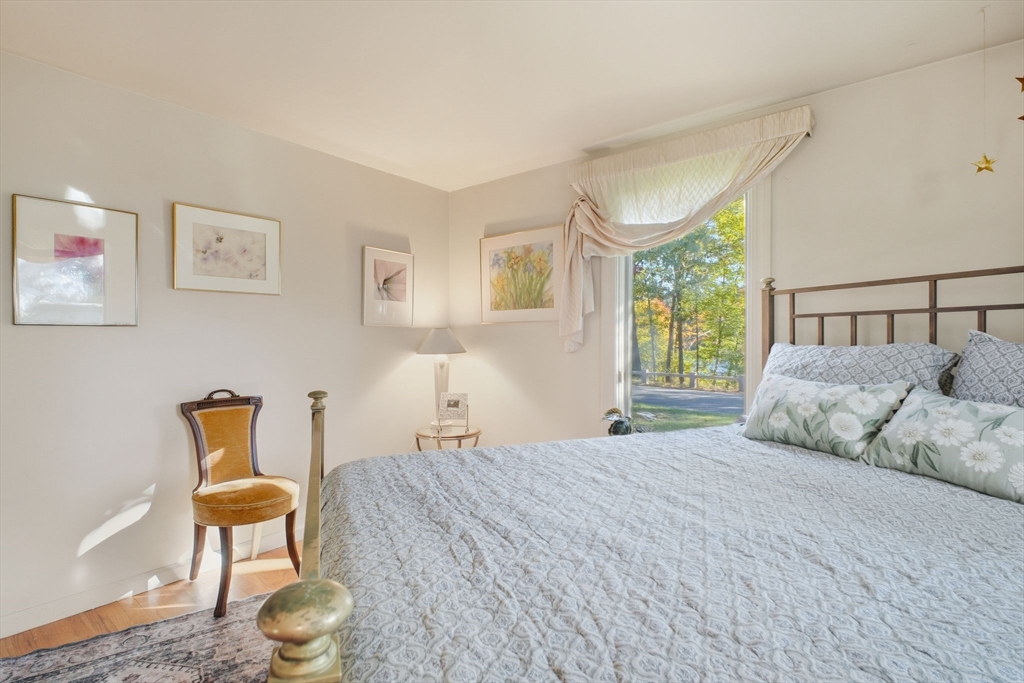28 Collingwood Road Springfield, MA 01119 - Photo 15 of 32 a bedroom with a bed and a chair with the wooden floor