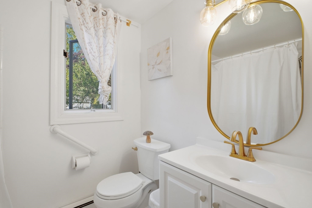 28 Collingwood Road Springfield, MA 01119 - Photo 19 of 32 a bathroom with a sink mirror and toilet