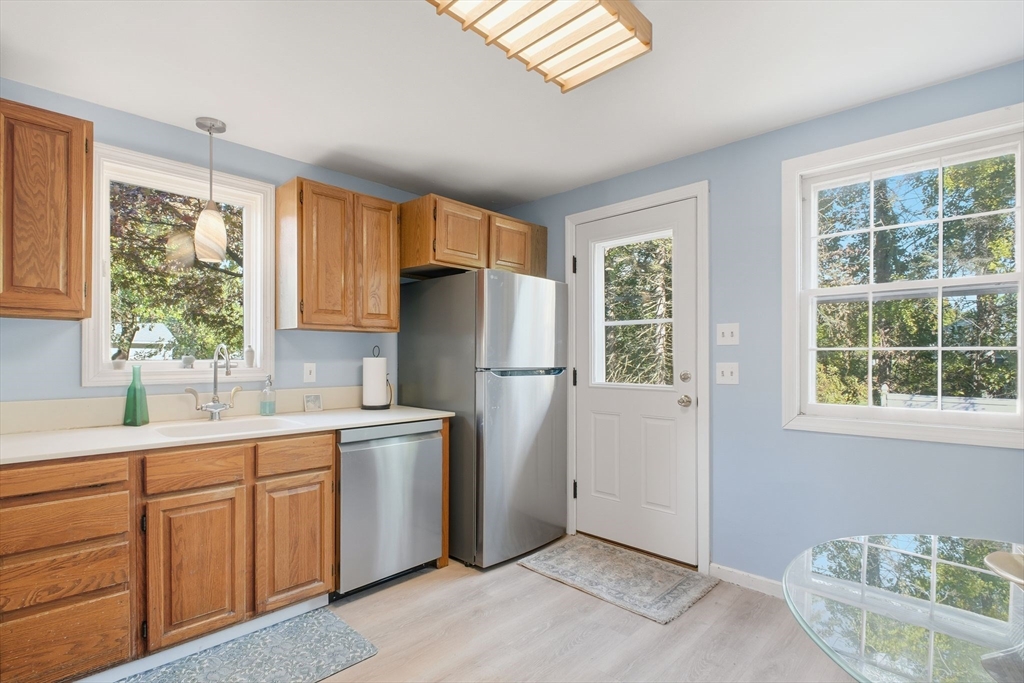 28 Collingwood Road Springfield, MA 01119 - Photo 10 of 32 a kitchen with a sink a refrigerator and window