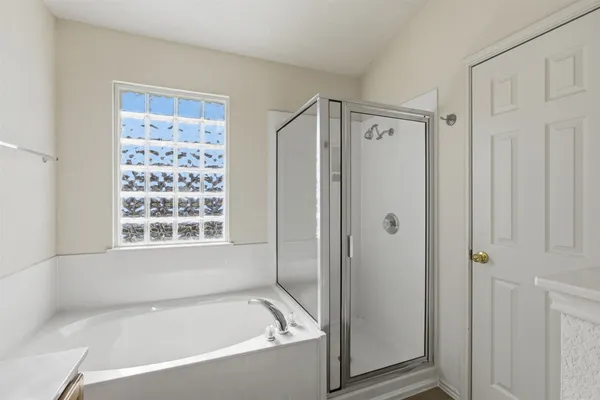 a white bath tub sitting next to a window