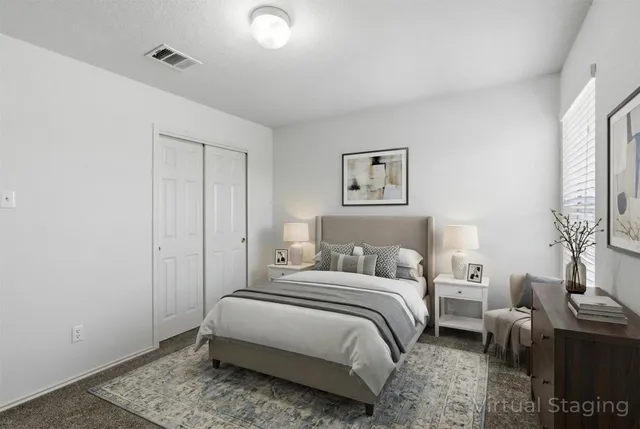 a bedroom with a bed and a couch