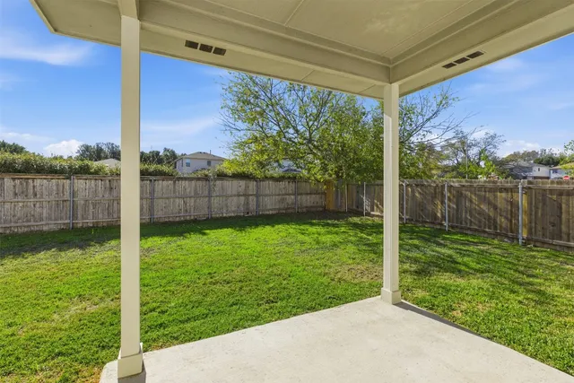 a view of a backyard with a garden and plants