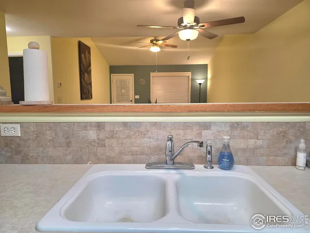 a bathroom with a sink a large mirror and a bathtub