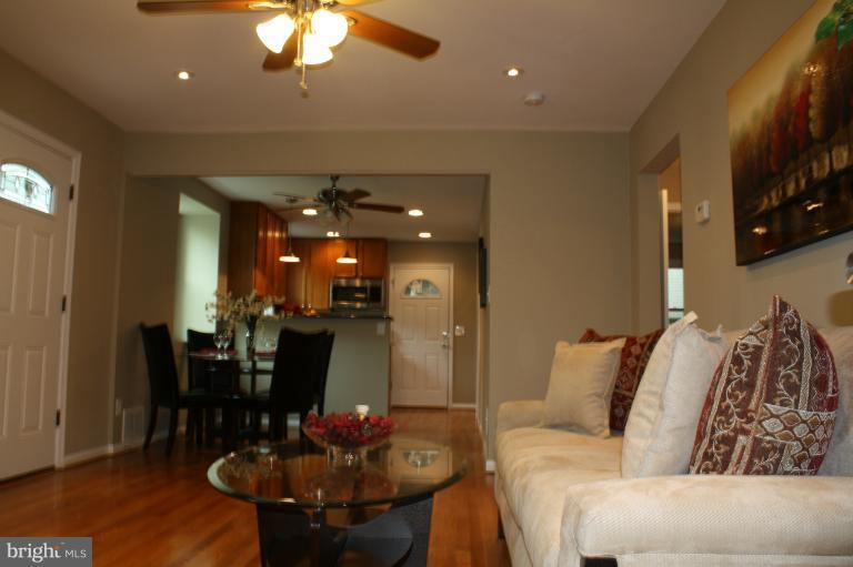 9314 Sudbury Road Silver Spring, MD 20901 - Photo 1 of 30 a living room with furniture and wooden floor