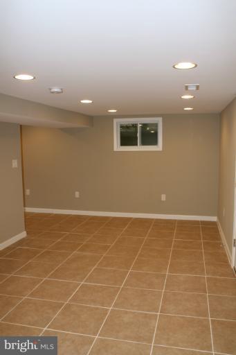 9314 Sudbury Road Silver Spring, MD 20901 - Photo 11 of 30 a view of an empty room with a window