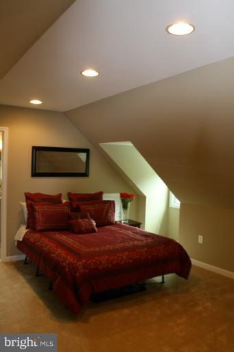 9314 Sudbury Road Silver Spring, MD 20901 - Photo 14 of 30 a bedroom with a bed and a night stand