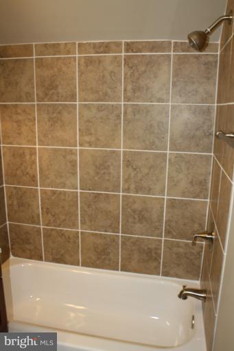 9314 Sudbury Road Silver Spring, MD 20901 - Photo 15 of 30 a bathroom with a bathtub