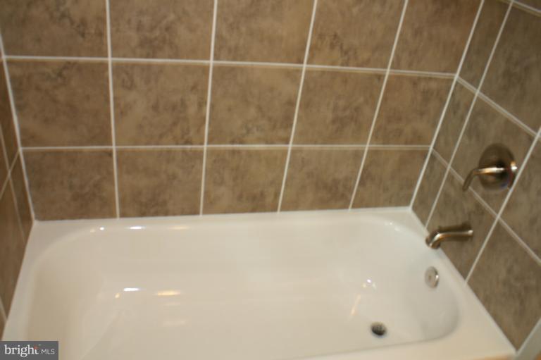 9314 Sudbury Road Silver Spring, MD 20901 - Photo 20 of 30 a bathroom with a bathtub