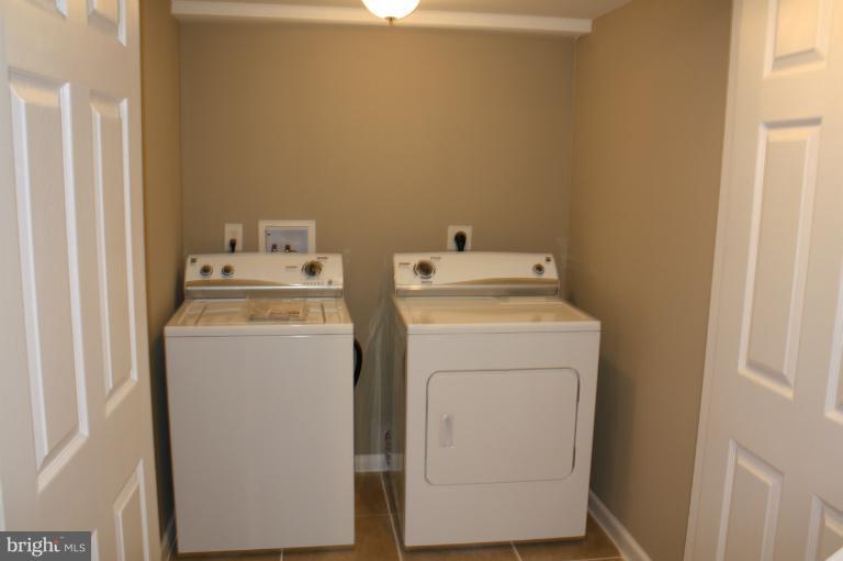 9314 Sudbury Road Silver Spring, MD 20901 - Photo 22 of 30 a utility room with dryer and washer